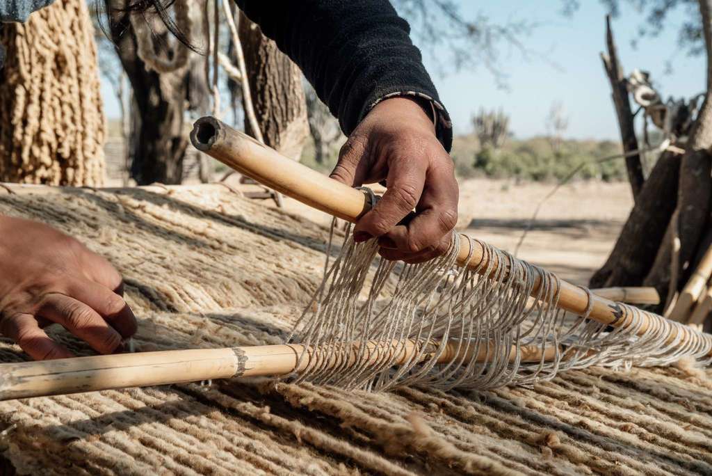 Weaving ladies wooden loom hands